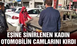 EŞİNE SİNİRLENEN KADIN OTOMOBİLİN CAMLARINI KIRDI